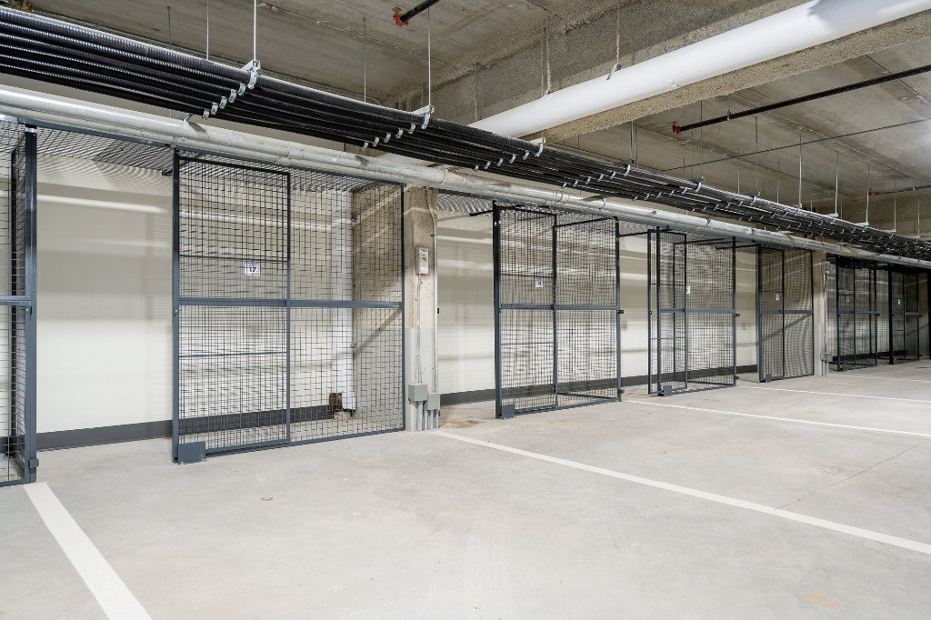 Secure wire-mesh storage lockers in the underground garage