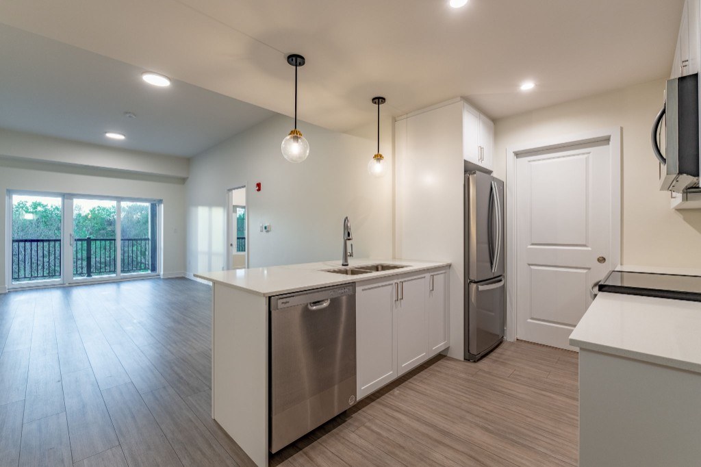 Suite 416 Caroline model — modern kitchen and living space at X Creemore Condos